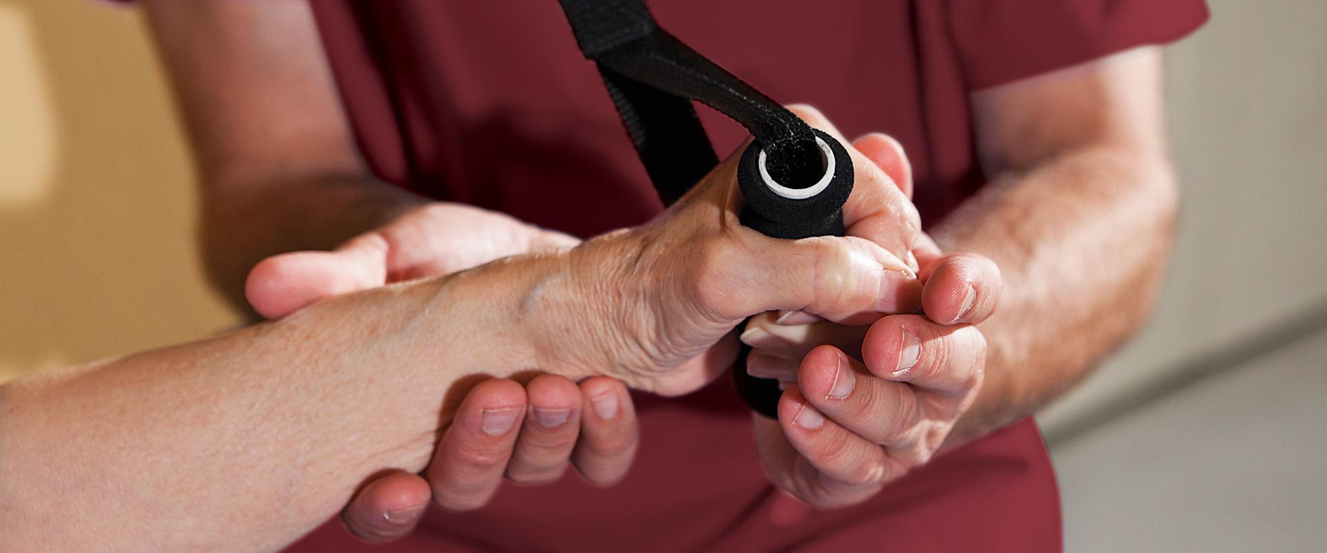 therapist and patients hands performing therapy exercise