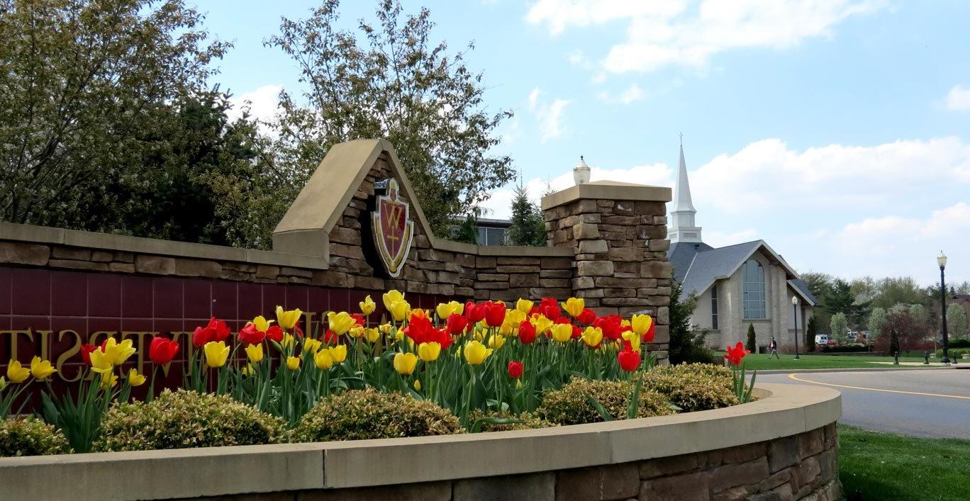 photo of Walsh University's entry sign at the corner of Founder's Drive and East Maple Street